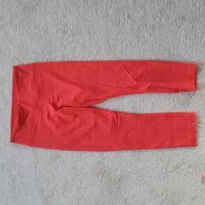 Dark orange Lululemon Wunder Under crop pants